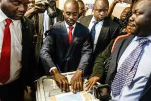 Opposition leader Nelson Chamisa (C) hopes to tap the youth vote. By Zinyange AUNTONY (AFP)
