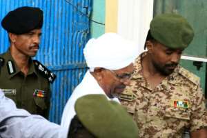 Ousted Sudanese president Omar al-Bashir outside the Kober prison in Khartoum in June, ahead of an appearance at the prosecutor's office. By Ebrahim Hamid (AFP/File)