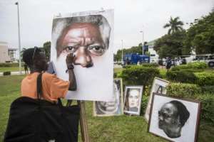 Outside the conference centre where Kofi Annan's body was lying in state, an artist was painting a portrait of the former UN secretary general.  By CRISTINA ALDEHUELA (AFP)