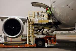 Oxford/AstraZenica Covid-19 vaccine doses are offloaded from a plane after its arrival in Abuja, Nigeria, on March 2, 2021. By Kola Sulaimon (AFP)