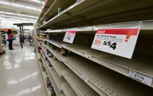 Panic-buying has been seen around the world as people stock up on essentials fearing a lengthy period of enforced quarantine. By Frederic J. BROWN (AFP)