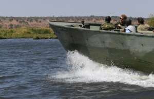 Patrol: The duke joined an anti-poaching unit on the Chobe River. By MONIRUL BHUIYAN (AFP)