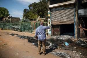Paul Dihi, who migrated from Ivory Coast in 1996, earned most of his income from the building he rented out to shopkeepers. By Michele Spatari (AFP)