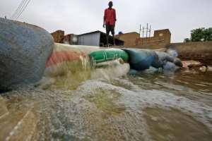 People have built barricades by filling bags with sand but the floods have broken through, destroying homes and property. By ASHRAF SHAZLY (AFP)