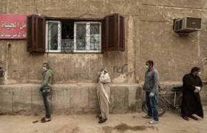 People in Cairo queue for food handouts. By Mohamed el-Shahed (AFP)