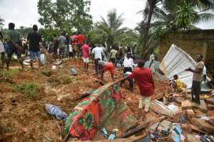 People search for survivors and bodies in the rubble of their former homes. By SIA KAMBOU (AFP)