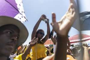 People sing during a collective 'welcome prayer' for Zuma. By GUILLEM SARTORIO (AFP)