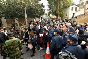People wait to enter Nicosia's Church of the Holy Cross before an ecumenical prayer with the pope. By Iakovos HATZISTAVROU (AFP)
