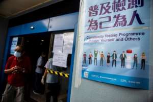 People wait at a COVID-19 coronavirus testing centre in Hong Kong. By ISAAC LAWRENCE (AFP)