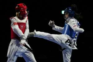 Peru's Leonor Espinoza Carranza (R) won taekwondo's inaugural gold in the women's K44 -49kg. By Yasuyoshi CHIBA (AFP)