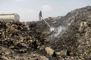 Pickers sometimes set illegal fires to flush out valuables. By JOHN WESSELS (AFP)