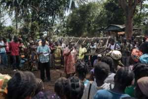 Pierrette Benguere, head of the Mbomou prefecture, addresses people displaced from Bangassou by the violence.  By ALEXIS HUGUET (AFP)