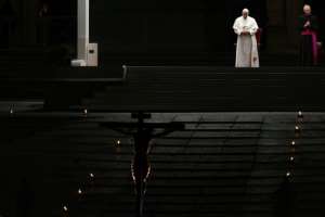 Pope Francis was due to livestream his Easter Vigil from an empty St Peter's Basilica after he presided over an empty Good Friday service to kick off the holiday weekend. By Vincenzo PINTO (AFP)