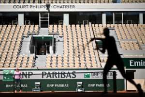 Players take part in a French Open warm-up session without spectators at Roland Garros. By Anne-Christine POUJOULAT (AFP)