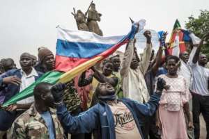 Protesters in Malian capital Bamako often wave Russian flags during demonstrations against French influence. By Michele Cattani (AFP/File)