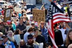 Protesters rally outside the New Hampshire State House calling for Governor Chris Sununu to open the state on May 2, 2020. By Joseph Prezioso (AFP)