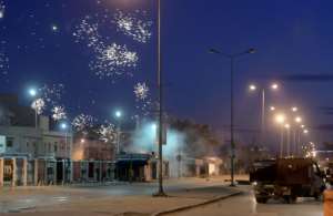 Protests broke out on Friday night; this photograph taken on January 17 shows demonstrations in suburbs surrounding the capital Tunis. By FETHI BELAID (AFP)