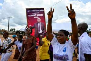 'President Laurent Gbagbo arrives for a true reconciliation of Ivorians', reads a poster at a pro-Gbagbo rally. By SIA KAMBOU (AFP)