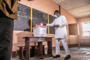 President Patrice Talon sported a mask when he voted early in Cotonou's Zongo-Ehuzu area. By Yanick Folly (AFP)