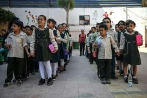 Pupils line up in the courtyard of the Mahaba school, which was founded 30 years ago by the pioneering anti-poverty activist Sister Emmanuelle. By Mohamed el-Shahed (AFP)