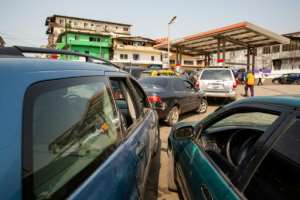 Queues at fuel stations often now start forming before the sun comes up. By Carielle Doe (AFP/File)