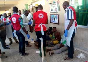 Red Cross workers attend to victims of Sunday's triple suicide bombing in Konduga. By Audu Ali MARTE (AFP)