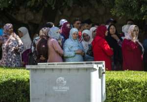 Relatives of men accused by a Moroccan teenager of gang-rape wait outside a courthouse in the central Moroccan city of Beni Mellal on October 10, 2018.  By FADEL SENNA (AFP)