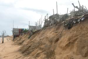 Relentless wind and wave action washes away 5-10 metres (16-32 feet) of shoreline every year, but in some places it can be up to 25 metres. By YANICK FOLLY (AFP)