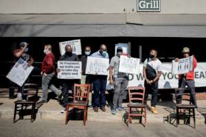 Restaurant workers gathered in Parktown North, Johannesburg as part of protests against the national lockdown regulations in July 2020. By Luca Sola (AFP/File)