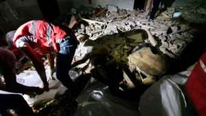 Rescuers search for bodies and survivors under the rubble. By Mahmud TURKIA (AFP)