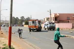 Residents burnt tyres and hurled rocks at the police, setting up barricades along the streets and damaging a local police station. By MICHELE SPATARI (AFP)