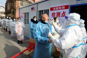 Residents of Shijiazhuang in northern Hebei, China line up for Coronavirus tests. By STR (CNS/AFP)