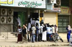 Residents of Khartoum queued outside a bank to withdraw money following the end of the strike. By - (AFP)