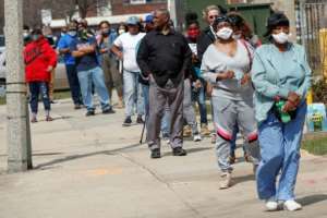 Residents of Milwaukee, Wisconsin, wait to cast their ballots in the state's presidential primary and local elections after the governor of the midwestern US state failed in his bid to postpone the vote. By KAMIL KRZACZYNSKI (AFP)