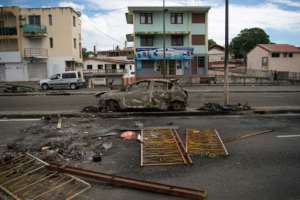 Returning restrictions have sparked rioting in some areas, including the French Caribbean island of Martinique where 10 police officers were injured on Thursday. By LOIC VENANCE (AFP)