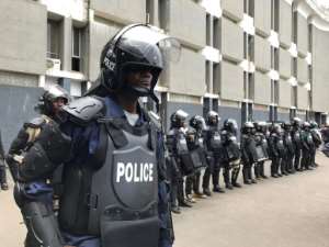 Riot police deployed outside an annex of the Capitol Building, the seat of the Liberian parliament. By CARIELLE DOE (AFP)