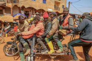 Room for one more: The bikes need an uprated suspension to cope with the heavy load. By Daniel Beloumou Olomo (AFP)