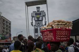 Robot cop: In 2015, the Kinshasa authorities installed three giant figures, equipped with lights and camera monitors, to try to unsnarl intersections. By FEDERICO SCOPPA (AFP)