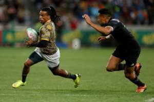 Rosko Specman (L), who scored two tries for the Bulls in his Super Rugby debut, playing for South Africa against New Zealand in a sevens international..  By GIANLUIGI GUERCIA (AFP/File)