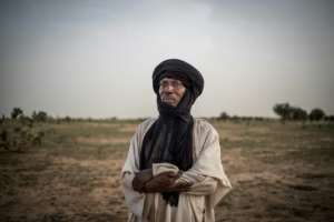 Rouada Sabgari, an elderly herder, wonders if his children will be able to carry on their ancient herding traditions. By Marco LONGARI (AFP)