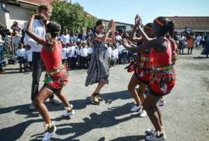 Royal moves: The duke and duchess with dancers at the Justice Desk, an NGO in Cape Town's rundown Nyanga district. By Courtney AFRICA (POOL/AFP)