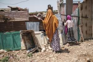 Rural families who lose their livelihood to drought or flood in Somalia often wind up on the outskirts of cities in squatter camps. By EDUARDO SOTERAS (AFP)