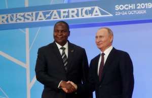 Russian President Vladimir Putin is seen here with Central African President Faustin Archangel Touadera; an investigation of a disinformation campaign on Facebook has linked the effort to Yevgeny Prigozhin, a key ally of the Russian leader. By Sergei CHIRIKOV (POOL/AFP/File)