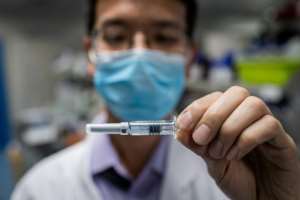 Scientists are racing to find a COVID-19 vaccine. By NICOLAS ASFOURI (AFP)