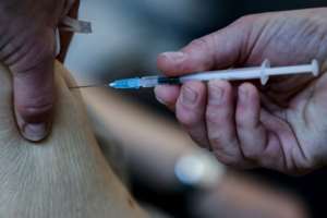 Scientists say jabs are the only way out of the pandemic, but for many people they are not being administered quickly enough. By Kenzo Tribouillard (AFP)