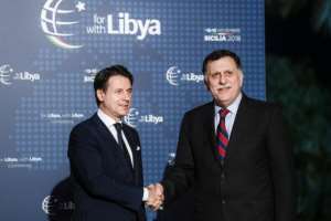 Sarraj (R), seen with Conte (L), went into a meeting with Haftar after their arrival. By Filippo MONTEFORTE (AFP)