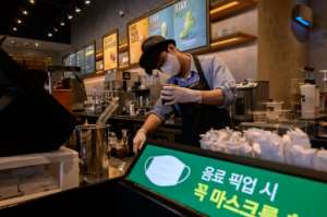 Seoul coffee shops are no longer restricted to take-aways only after cases fell back. By Ed JONES (AFP/File)