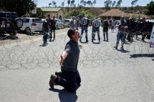 Security was strong at the courthouse where two suspects in a white farmer murder appeared. By Marco LONGARI (AFP)