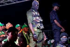 Security agents at a rally staged by Issa Sall in Dakar on February 3. By SEYLLOU (AFP)