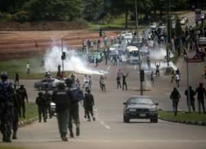 Security forces fire tear gas at protesters in Abuja. By Kola Sulaimon (AFP)